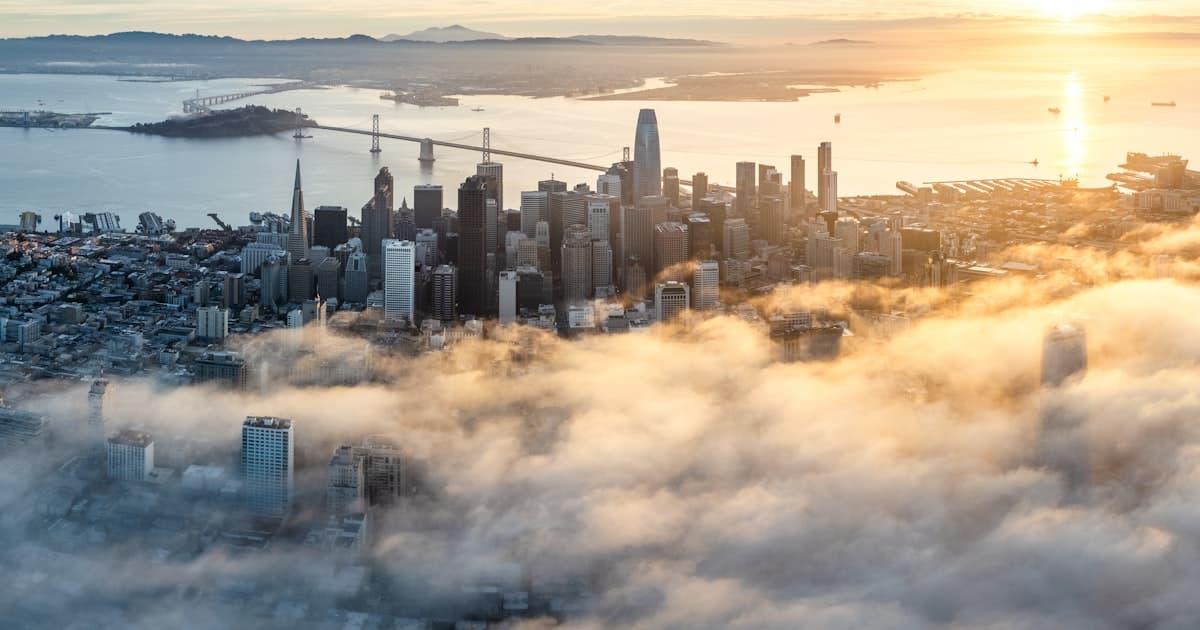 San Francisco towers rising above morning fog
